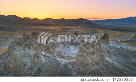 Aerial Trona Pinnacles Sunrise Over Desert Landscape With Mountain Range Aerial Trona Pinnacles Sunrise Over Desert Landscape With Mountain Range 142880556