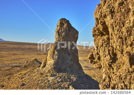 Trona Pinnacles Desert Landscape with Tufa Spire and Golden Hour Light Trona Pinnacles Desert Landscape with Tufa Spire and Golden Hour Light 142880564