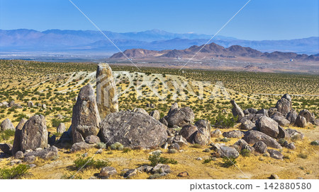 Trona Pinnacles Rock Formations at Golden Hour with Desert and Distant Mountains Trona Pinnacles Rock Formations at Golden Hour with Desert and Distant Mountains 142880580