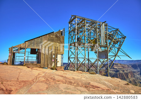 Abandoned Mine Structure and Weathered Building Overlooking Grand Canyon West Arizona Abandoned Mine Structure and Weathered Building Overlooking Grand Canyon West Arizona 142880583
