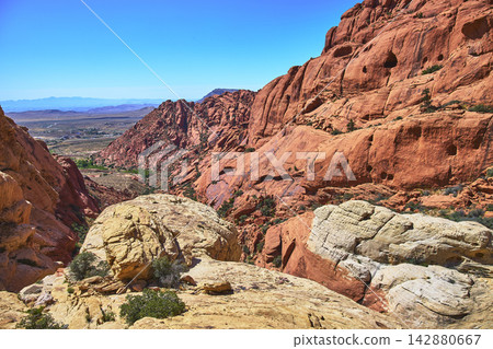 Red Rock Canyon Landscape with Desert Valley and Dramatic Sandstone Formations 142880667
