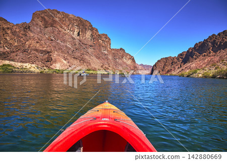 Kayak Bow on Colorado River Surrounded by Rocky Canyon and Blue Water Adventure Kayak Bow on Colorado River Surrounded by Rocky Canyon and Blue Water Adventure 142880669