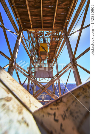Abandoned Mine Structure with Weathered Metal and Grand Canyon Cliffs Perspective Abandoned Mine Structure with Weathered Metal and Grand Canyon Cliffs Perspective 142880903