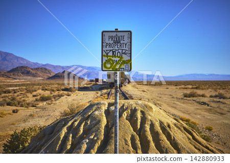Private Property Sign Graffiti and Train Track in Trona Pinnacles Desert California Private Property Sign Graffiti and Train Track in Trona Pinnacles Desert California 142880933