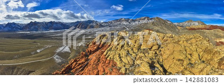 Aerial Red Rock Canyon Sandstone Formations Scenic Drive and Snowy Peaks Panorama Aerial Red Rock Canyon Sandstone Formations Scenic Drive and Snowy Peaks Panorama 142881083