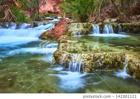 Terraced Waterfalls Flowing Over Travertine Pools with Lush Greenery in Arizona Terraced Waterfalls Flowing Over Travertine Pools with Lush Greenery in Arizona 142881121