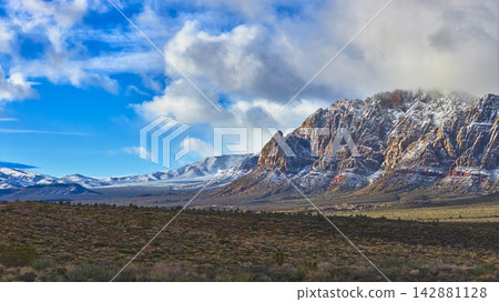 Snow Capped Red Rock Mountains and Desert Landscape Nevada Winter Scenic Snow Capped Red Rock Mountains and Desert Landscape Nevada Winter Scenic 142881128