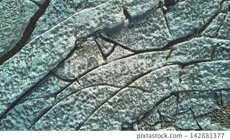 Aerial Frozen Lake Cracked Ice Sheets Winter Texture Top Down Aerial Frozen Lake Cracked Ice Sheets Winter Texture Top Down 142881377