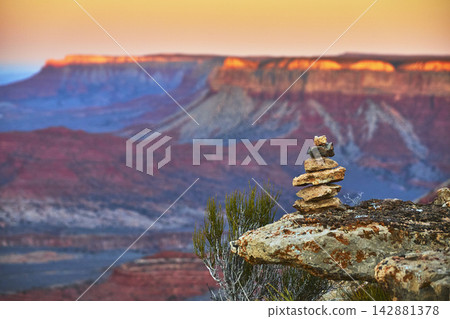 Rock Cairn and Sunrise Light Over Grand Canyon Layers at Twin Point Overlook Rock Cairn and Sunrise Light Over Grand Canyon Layers at Twin Point Overlook 142881378
