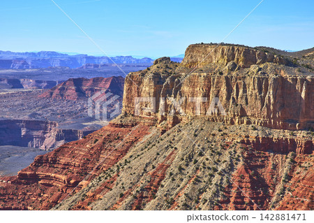Grand Canyon Red Rock Cliffs and Layered Landscape Under Bright Blue Sky Grand Canyon Red Rock Cliffs and Layered Landscape Under Bright Blue Sky 142881471