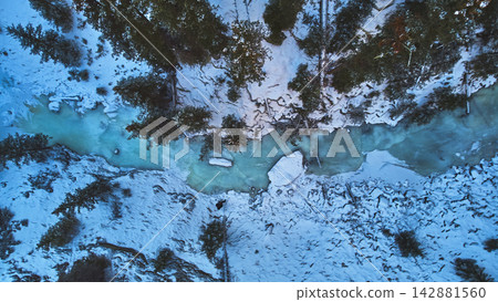 Aerial Frozen River Snowy Forest and Winter Landscape Top Down Aerial Frozen River Snowy Forest and Winter Landscape Top Down 142881560