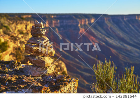 Rock Stack and Desert Shrub Overlooking Grand Canyon at Sunset Rock Stack and Desert Shrub Overlooking Grand Canyon at Sunset 142881644