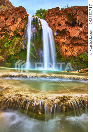 Havasu Falls Turquoise Waterfall Red Rock Cliffs and Pools in Arizona Canyon Havasu Falls Turquoise Waterfall Red Rock Cliffs and Pools in Arizona Canyon 142881717