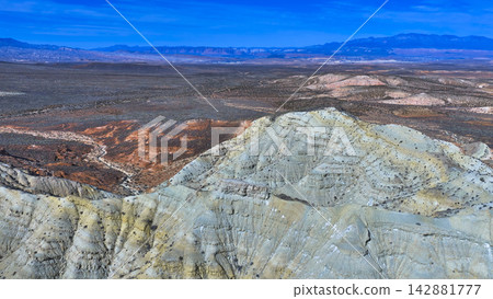 Aerial Arizona Strip Desert Landscape With Rugged Hills and Distant Mountain Ranges Aerial Arizona Strip Desert Landscape With Rugged Hills and Distant Mountain Ranges 142881777