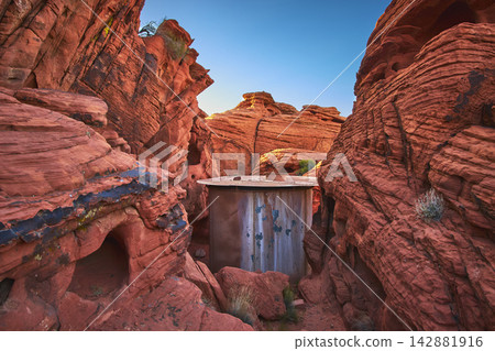 Abandoned Silo Between Red Sandstone Cliffs in Valley of Fire Nevada Desert Abandoned Silo Between Red Sandstone Cliffs in Valley of Fire Nevada Desert 142881916