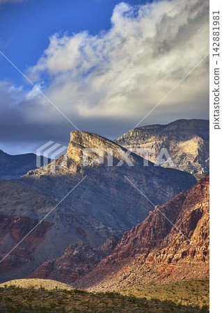Turtlehead Peak Red Rock Canyon Dramatic Winter Clouds and Sunlit Desert Landscape Turtlehead Peak Red Rock Canyon Dramatic Winter Clouds and Sunlit Desert Landscape 142881981