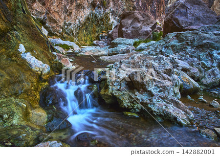 Goldstrike Hot Spring Waterfall and Geothermal Pool Among Rocky Canyon Walls Goldstrike Hot Spring Waterfall and Geothermal Pool Among Rocky Canyon Walls 142882001