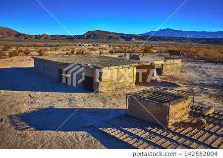 Ghost Town Ruins Desert Landscape and Distant Mountains Nevada Ghost Town Ruins Desert Landscape and Distant Mountains Nevada 142882004