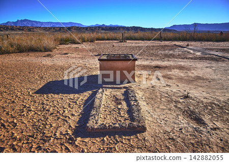 Desert Mud Crack Ghost Town Ruins and Distant Mountains Nevada 142882055
