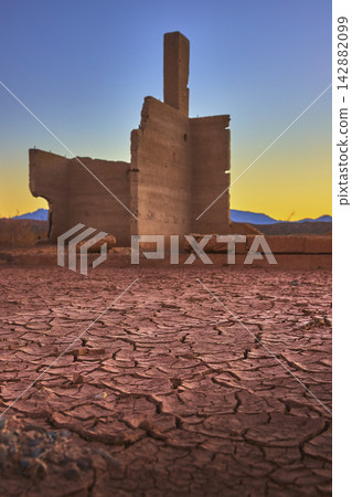 Golden Hour Ghost Town Ruins and Desert Mud Crack in Nevada Golden Hour Ghost Town Ruins and Desert Mud Crack in Nevada 142882099