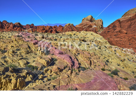 Colorful Sandstone Formations and Rugged Terrain in Valley of Fire Prospect Trail Colorful Sandstone Formations and Rugged Terrain in Valley of Fire Prospect Trail 142882229