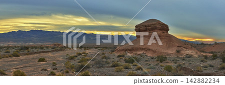 Panorama Desert Rock Formation at Golden Hour with Mountains and Dramatic Sky Panorama Desert Rock Formation at Golden Hour with Mountains and Dramatic Sky 142882234