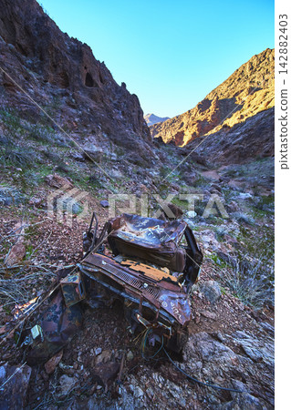 Abandoned Rusted Car with Graffiti in Rocky Nevada Canyon Near Goldstrike Hot Spring Abandoned Rusted Car with Graffiti in Rocky Nevada Canyon Near Goldstrike Hot Spring 142882403