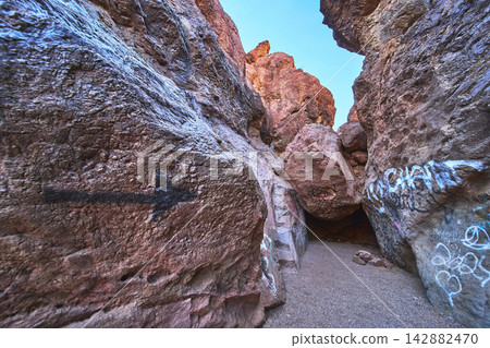 Desert Canyon Graffiti Arrow and Boulder at Goldstrike Hot Spring Nevada Desert Canyon Graffiti Arrow and Boulder at Goldstrike Hot Spring Nevada 142882470