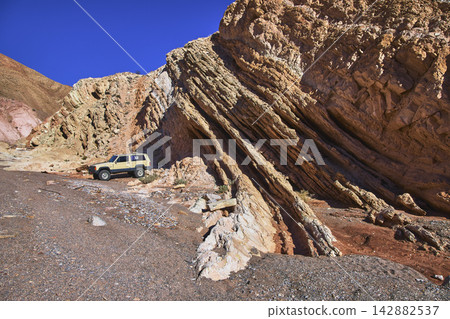 Off Road Car Rugged Rock Formations and Desert Landscape in Nevada Off Road Car Rugged Rock Formations and Desert Landscape in Nevada 142882537