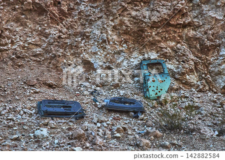 Abandoned Car Doors and Shooting Range Remnants in Nevada Desert Quarry Abandoned Car Doors and Shooting Range Remnants in Nevada Desert Quarry 142882584