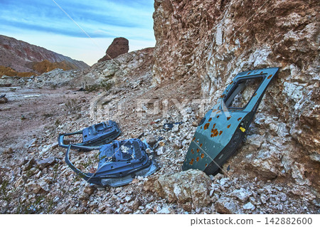 Abandoned Car Door Shooting Range in Rocky Desert Landscape Nevada Abandoned Car Door Shooting Range in Rocky Desert Landscape Nevada 142882600
