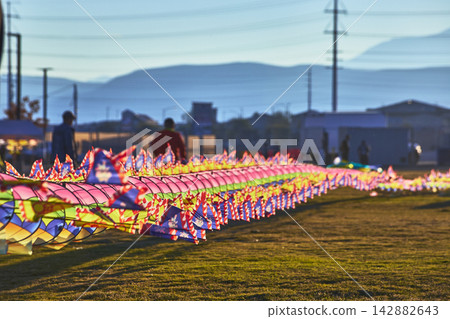 Colorful Kite Display at Las Vegas Nevada Festival During Golden Hour with Mountains Colorful Kite Display at Las Vegas Nevada Festival During Golden Hour with Mountains 142882643