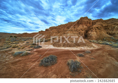 Cathedral Gorge State Park Red Rock Formations and Desert Landscape Under Dramatic Sky Cathedral Gorge State Park Red Rock Formations and Desert Landscape Under Dramatic Sky 142882685