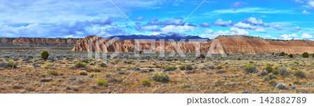 Cathedral Gorge State Park Panorama Dramatic Cliffs Desert Landscape and Distant Mountains Cathedral Gorge State Park Panorama Dramatic Cliffs Desert Landscape and Distant Mountains 142882789