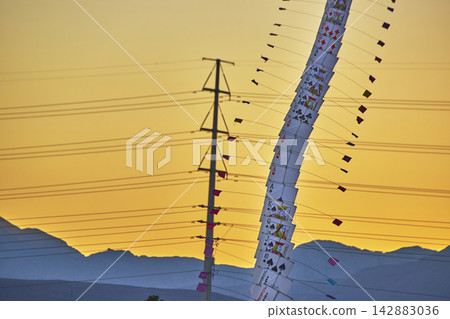 Playing Card Kite at Las Vegas Festival with Power Lines and Sunset Mountains Playing Card Kite at Las Vegas Festival with Power Lines and Sunset Mountains 142883036
