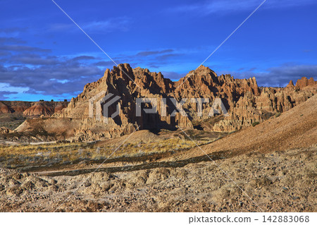 Cathedral Gorge State Park Dramatic Eroded Cliffs and Blue Sky Nevada Landscape Cathedral Gorge State Park Dramatic Eroded Cliffs and Blue Sky Nevada Landscape 142883068