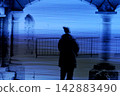 A woman standing in the middle of winter 142883490