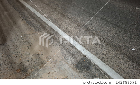 White Painted Line Marking on Asphalt Road Surface White Painted Line Marking on Asphalt Road Surface 142883551