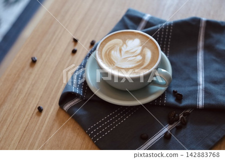 Latte art in a sage green cup Latte art in a sage green cup 142883768