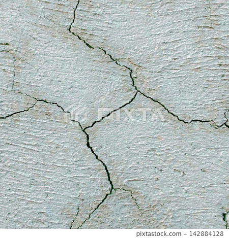 Light gray textured plaster wall with deep cracks Light gray textured plaster wall with deep cracks 142884128