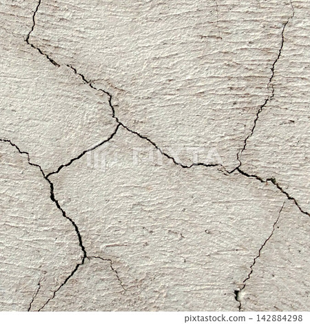 Light Gray Textured Plaster Wall with Deep Cracks 142884298