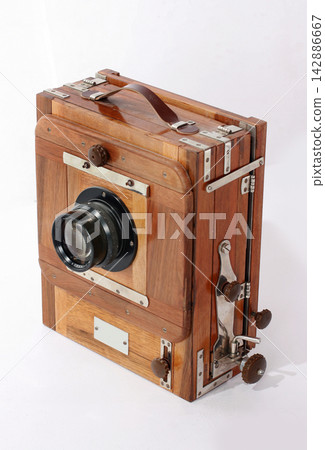 Old antique vintage black camera the 19th century isolated on white background with cliping path. Russia. Old antique vintage black camera the 19th century isolated on white background with cliping path. Russia. 142886667