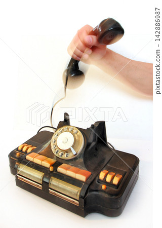 Old grunge vintage Dial Phone on white isolated Old grunge vintage Dial Phone on white isolated 142886987