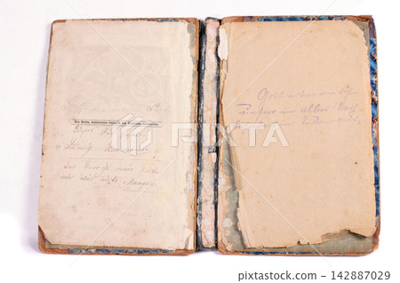 Old antique vintage open book on white 142887029