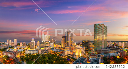 Coastal cityscape of St Petersburg, Florida, USA. Illuminated downtown area with modern architecture and scenic views of urban infrastructure in evening. Coastal cityscape of St Petersburg, Florida, USA. Illuminated downtown area with modern architecture and scenic views of urban infrastructure in evening. 142887612