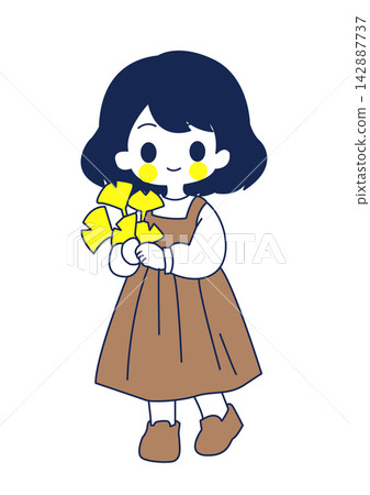 A girl holding a ginkgo leaf 142887737