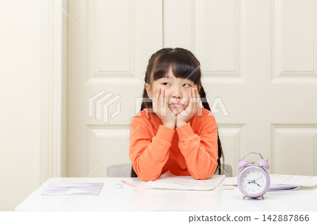 Bored little girl leaning on her hands and looking away with a dissatisfied expression. Bored little girl leaning on her hands and looking away with a dissatisfied expression. 142887866