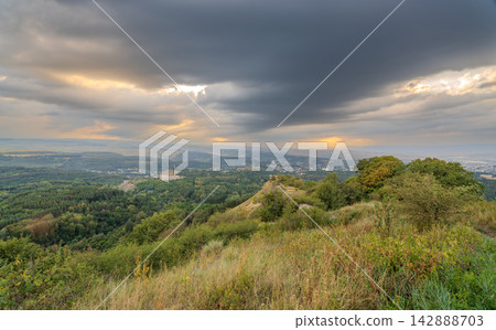 View of the mountains and Kislovodsk from the observation decks of the Kislovodsk Park. Evening sunset over the mountains of Kislovodsk. View of the mountains and Kislovodsk from the observation decks of the Kislovodsk Park. Evening sunset over the mountains of Kislovodsk. 142888703
