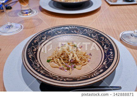 Creative French pasta dishes featuring Okinawan ingredients, served on beautiful decorative plates [Okinawa Gourmet Photos] 142888871