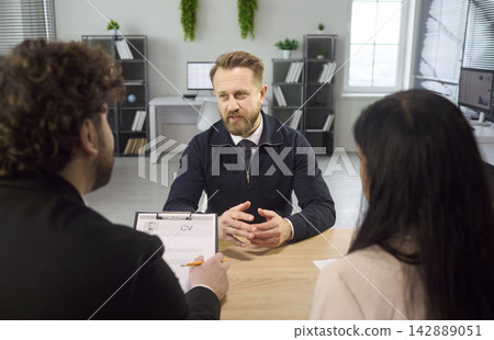 Candidate in job interview with HR recruiters during formal office meeting 142889051